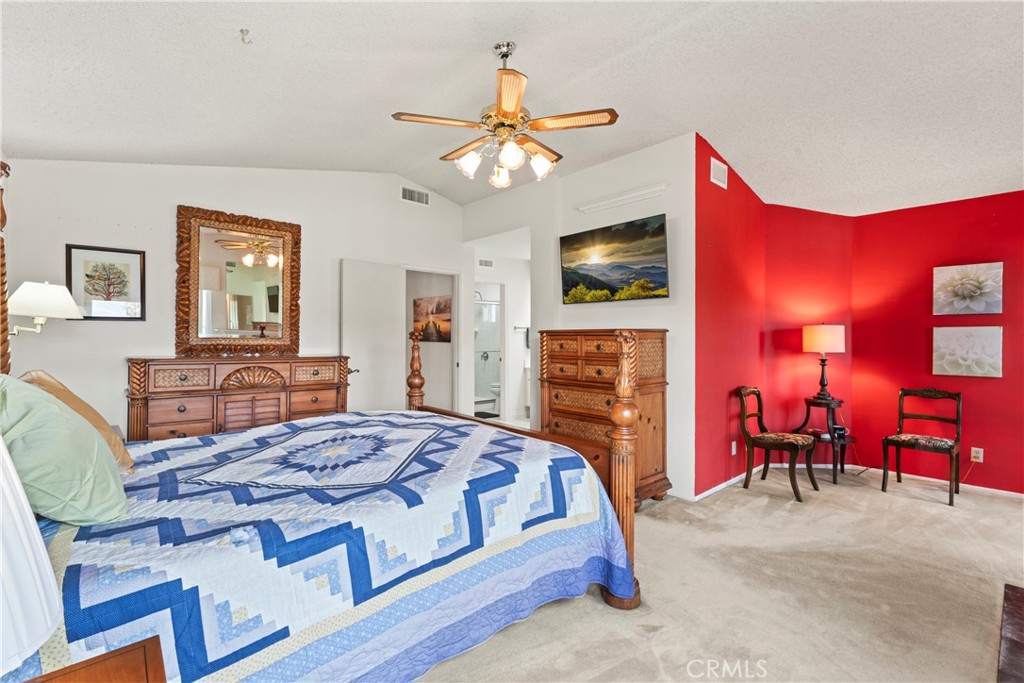 1749 Parkview Redlands, CA 92374 - Photo 26 of 55 a bedroom with a bed and a chandelier