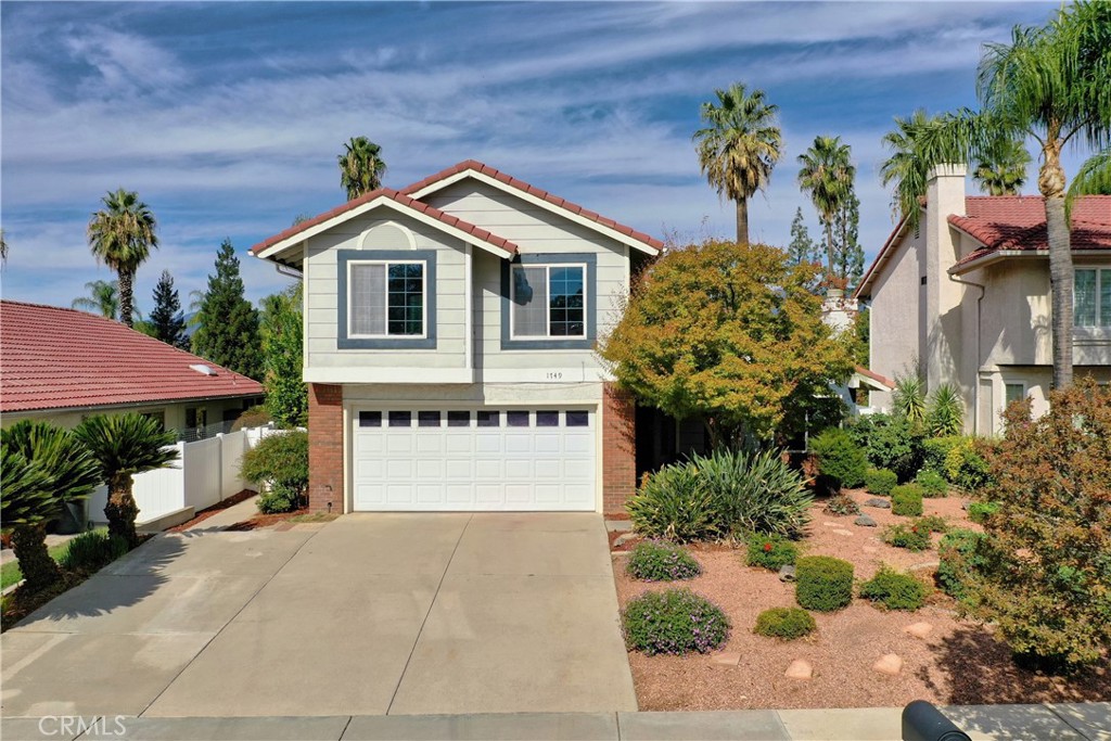 1749 Parkview Redlands, CA 92374 - Photo 3 of 55 a front view of a house with a yard and garage