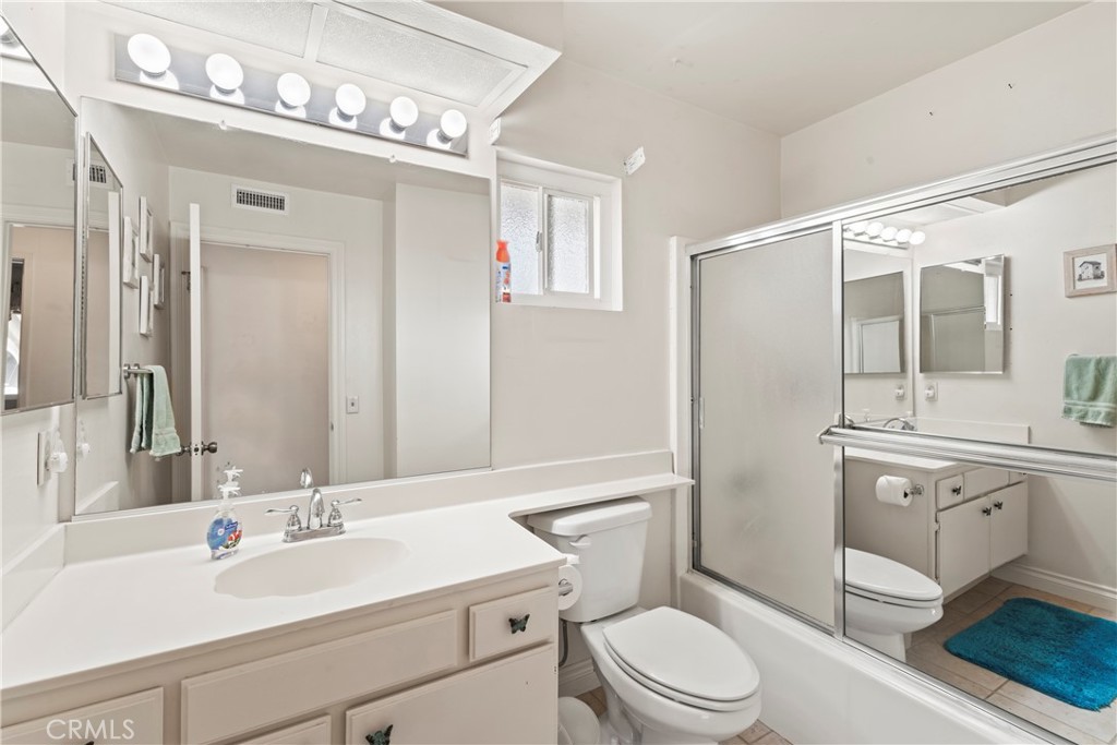 1749 Parkview Redlands, CA 92374 - Photo 40 of 55 a bathroom with a sink a toilet a mirror and shower