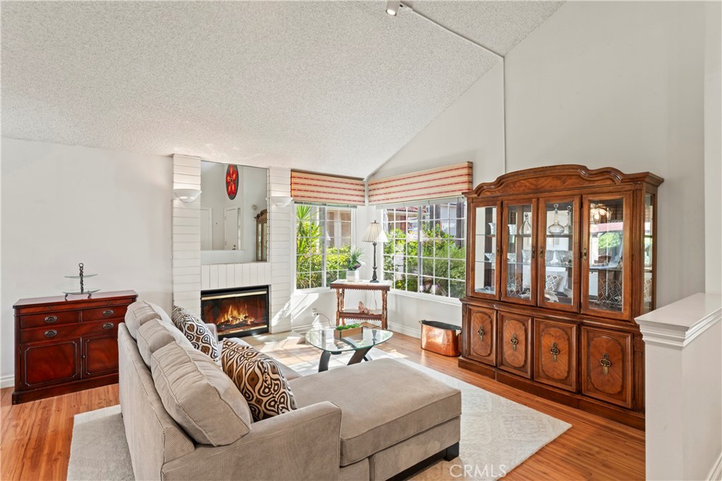 1749 Parkview Redlands, CA 92374 - Photo 8 of 55 a living room with furniture a fireplace and a floor to ceiling window