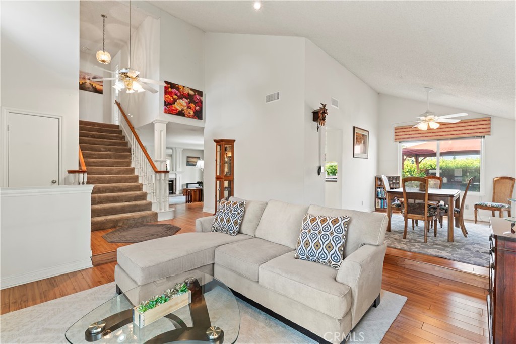 1749 Parkview Redlands, CA 92374 - Photo 10 of 55 a living room with furniture and a dining table with wooden floor