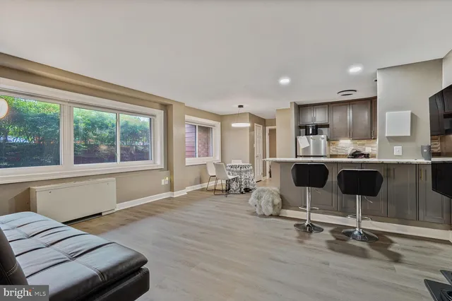 a kitchen with a sink cabinets and window