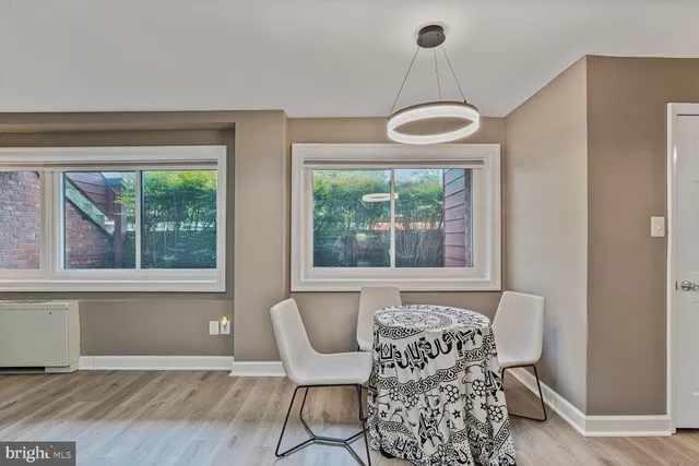 a view of a room with furniture and windows