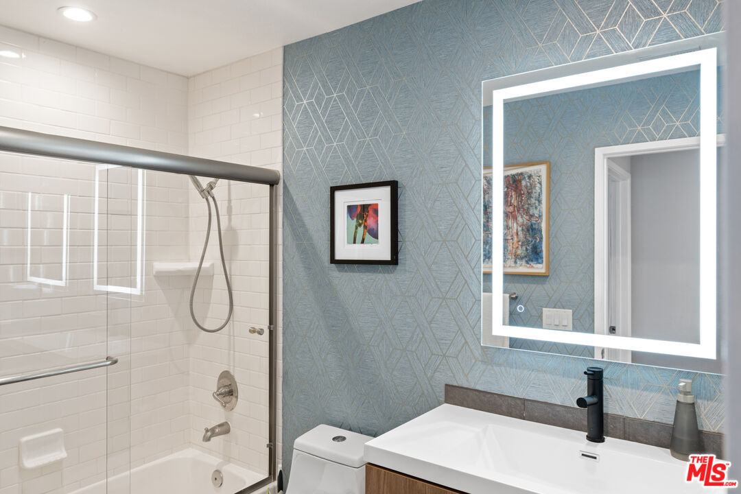1450 East Racquet Club Road Palm Springs, CA 92262 - Photo 14 of 31 a bathroom with a bathtub and a shower