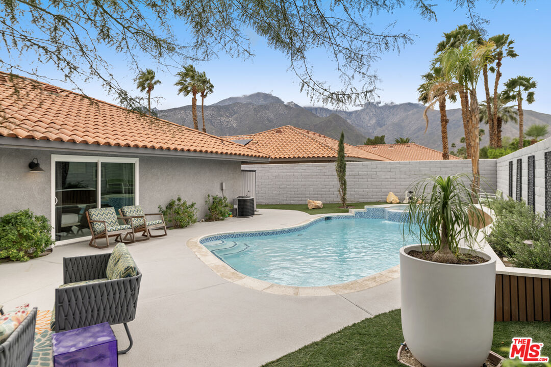 1450 East Racquet Club Road Palm Springs, CA 92262 - Photo 18 of 31 a view of a house with backyard and sitting area