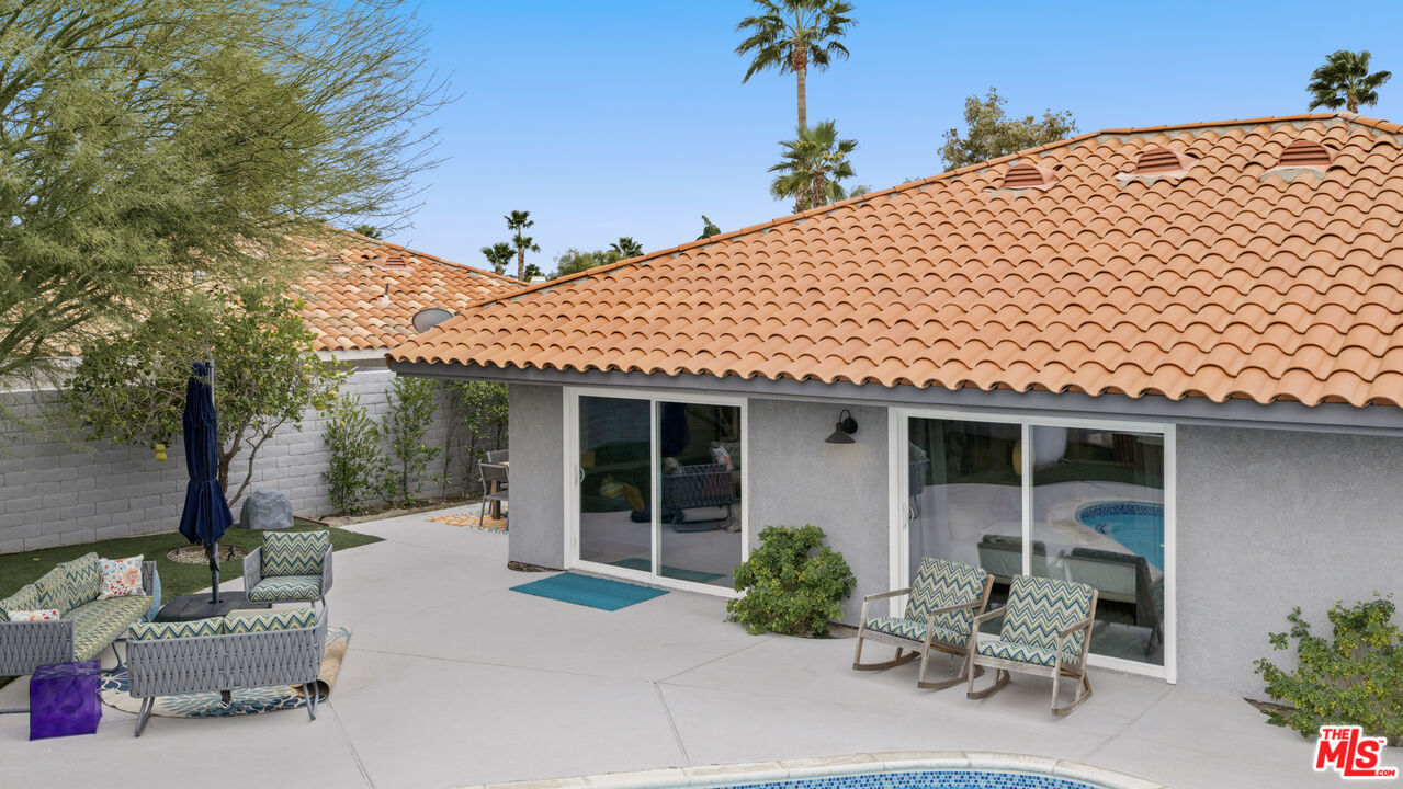 1450 East Racquet Club Road Palm Springs, CA 92262 - Photo 21 of 31 a front view of a house with garden
