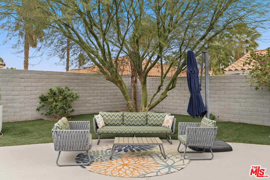 1450 East Racquet Club Road Palm Springs, CA 92262 - Photo 22 of 31 a view of a patio in the backyard