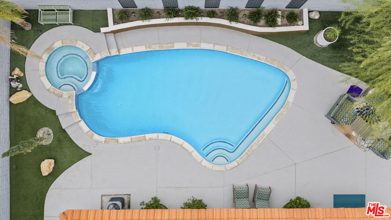 1450 East Racquet Club Road Palm Springs, CA 92262 - Photo 25 of 31 a view of a swimming pool with a balcony