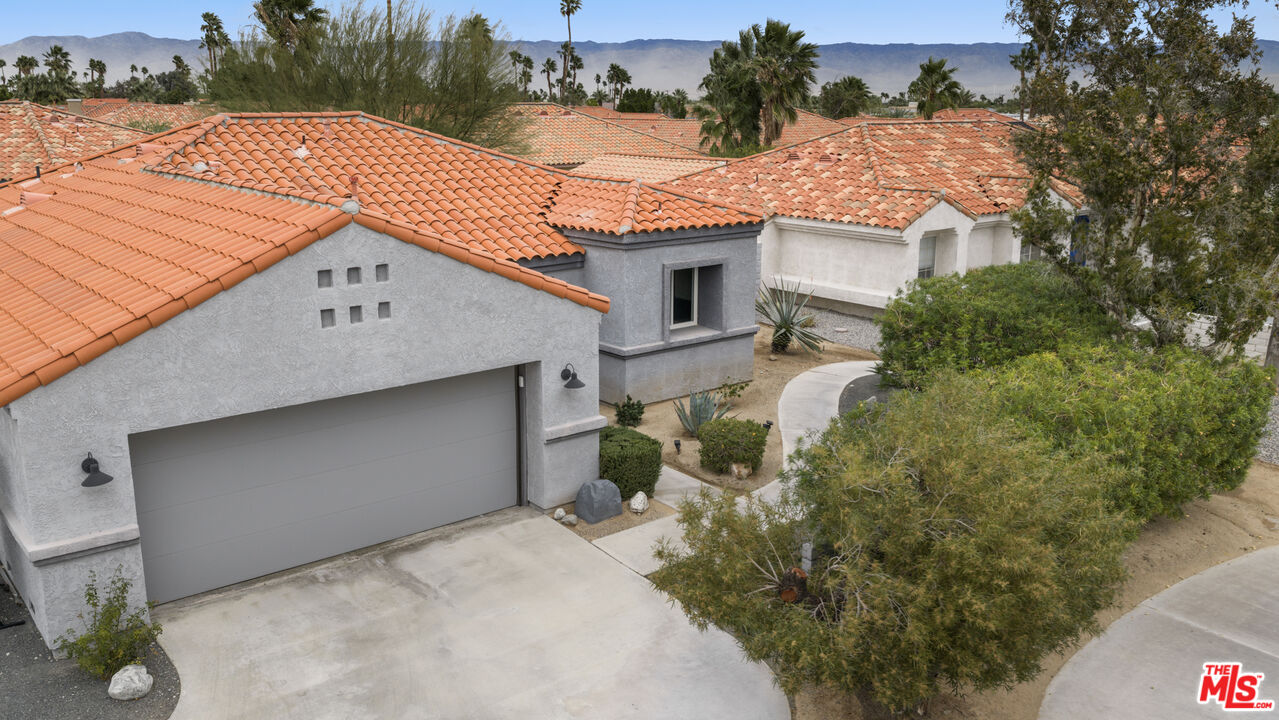 1450 East Racquet Club Road Palm Springs, CA 92262 - Photo 27 of 31 a aerial view of a house with a yard