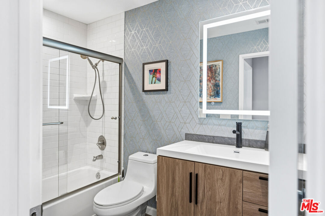 1450 East Racquet Club Road Palm Springs, CA 92262 - Photo 30 of 31 a bathroom with a sink toilet and shower
