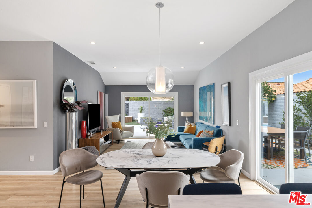 1450 East Racquet Club Road Palm Springs, CA 92262 - Photo 6 of 31 a view of a dining room with furniture window and outside view