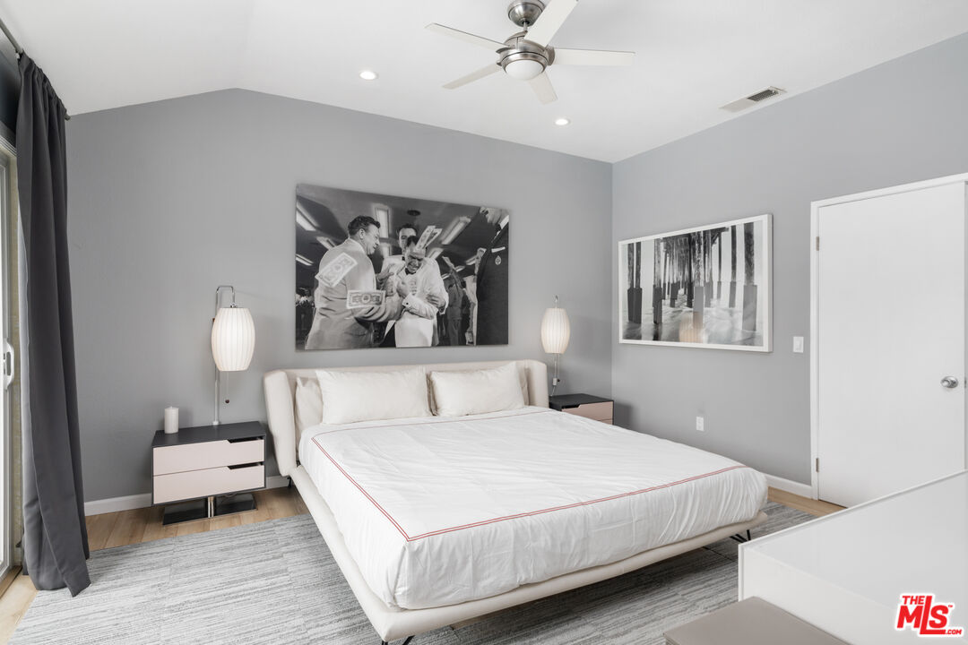 1450 East Racquet Club Road Palm Springs, CA 92262 - Photo 8 of 31 a bedroom with a bed and a painting on the wall