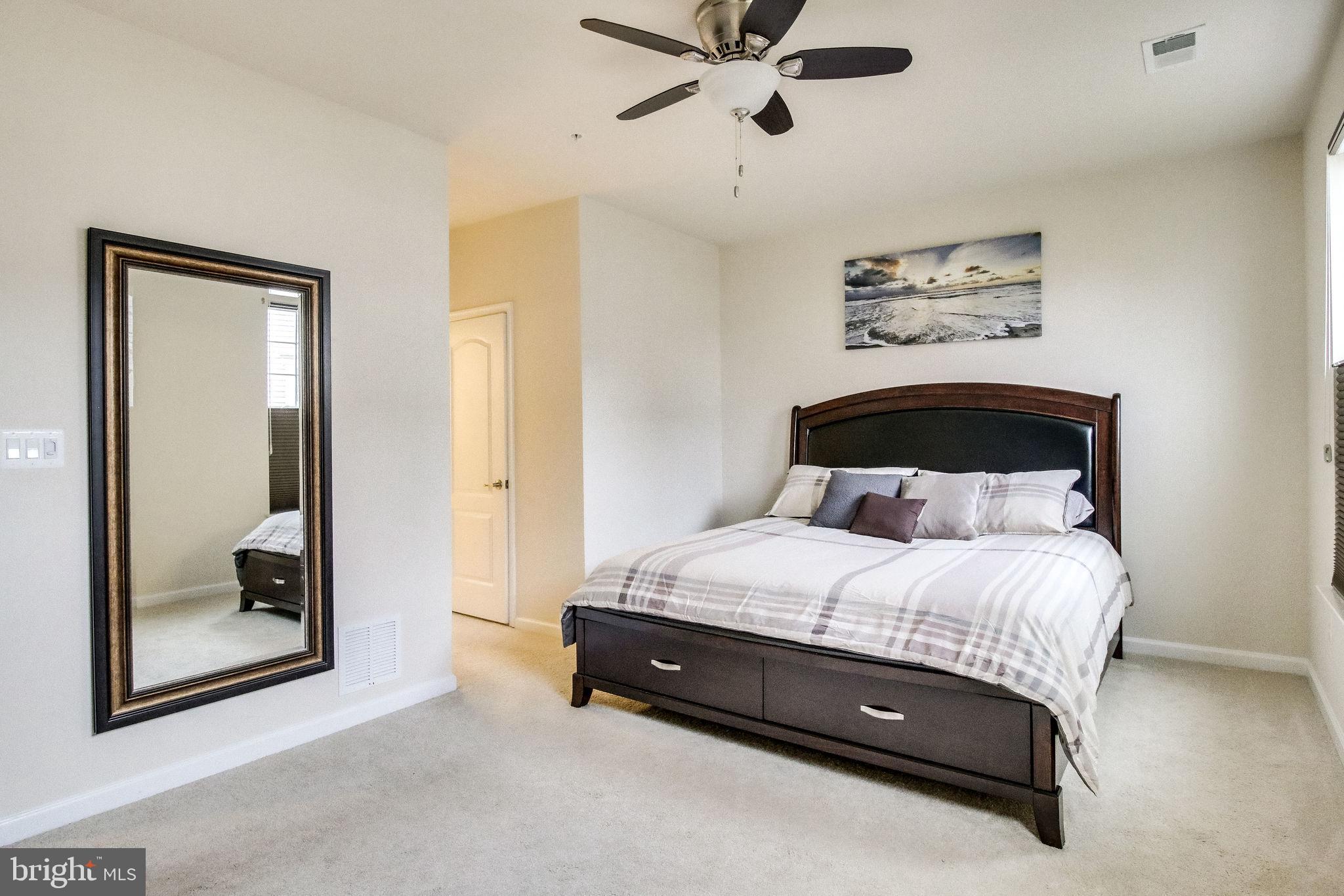 4847 Dane Ridge Circle, Unit 87 Woodbridge, VA 22193 - Photo 18 of 35 Serene bedroom with natural light and style.