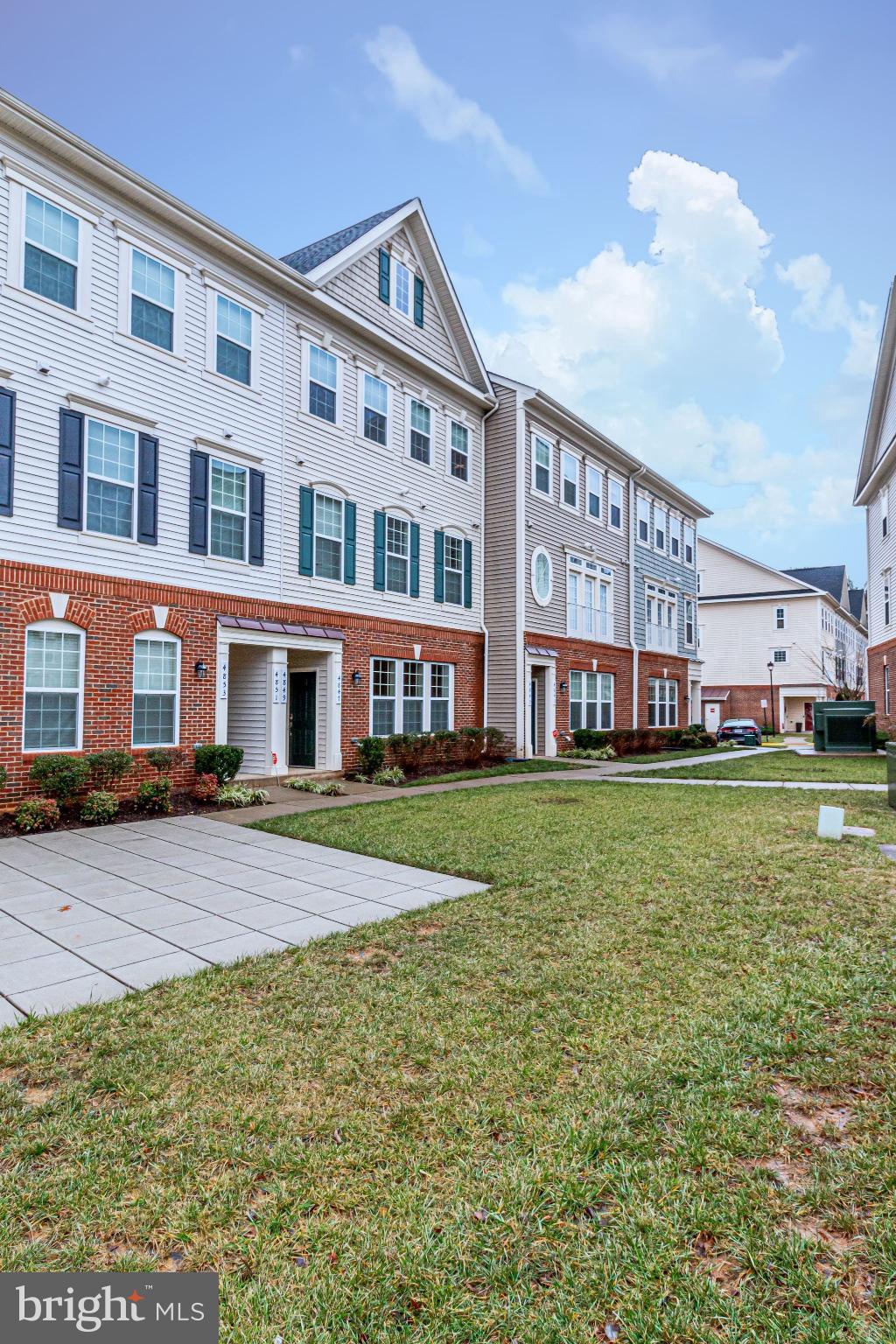 4847 Dane Ridge Circle, Unit 87 Woodbridge, VA 22193 - Photo 2 of 35 Charming townhome community with lush greenery.