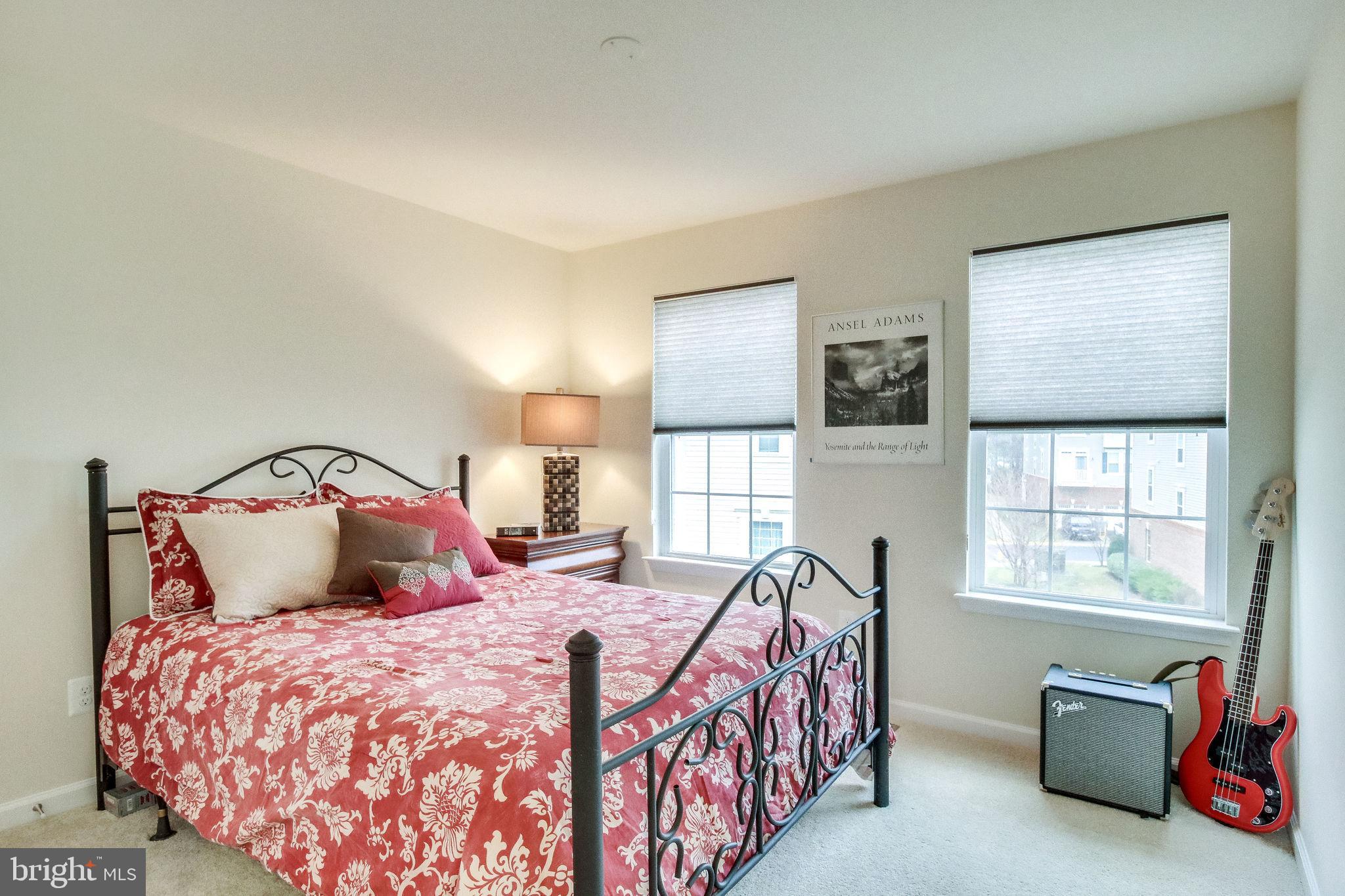 4847 Dane Ridge Circle, Unit 87 Woodbridge, VA 22193 - Photo 23 of 35 Charming bedroom with vibrant decor.