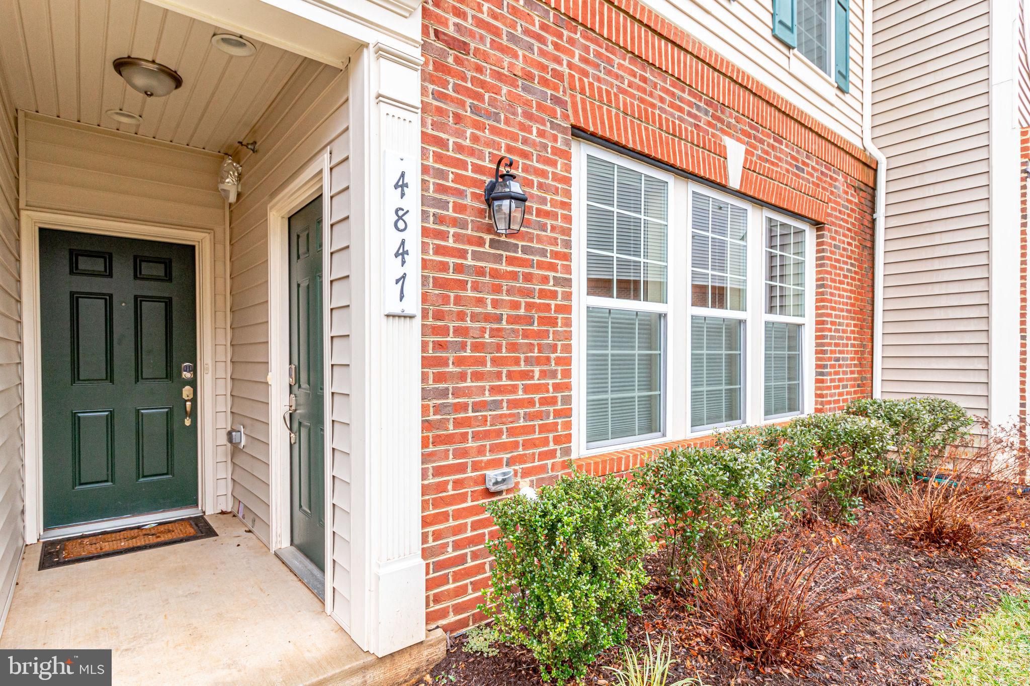 4847 Dane Ridge Circle, Unit 87 Woodbridge, VA 22193 - Photo 3 of 35 Charming entryway with lush greenery.
