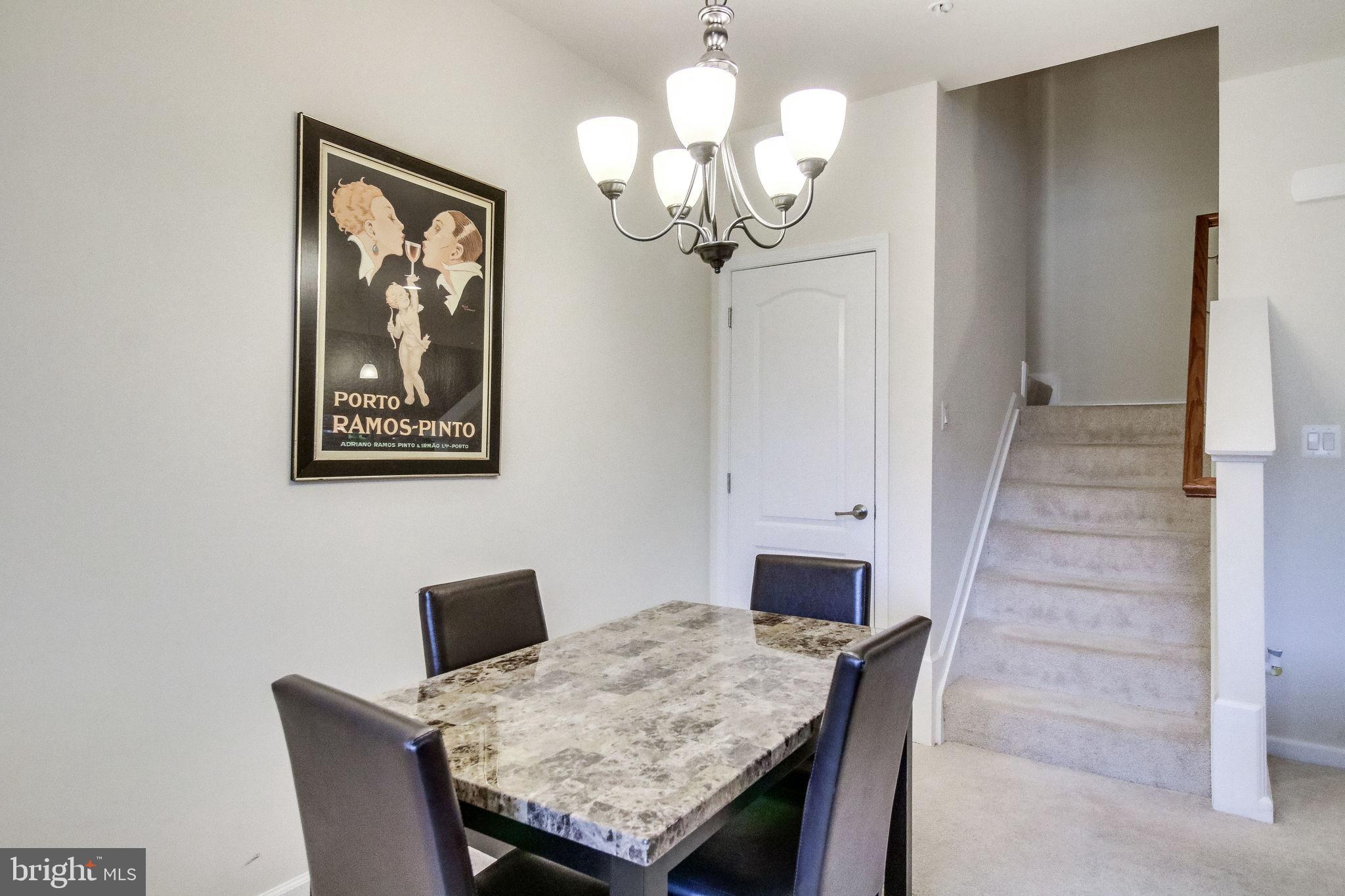 4847 Dane Ridge Circle, Unit 87 Woodbridge, VA 22193 - Photo 5 of 35 Chic dining space with elegant staircase.