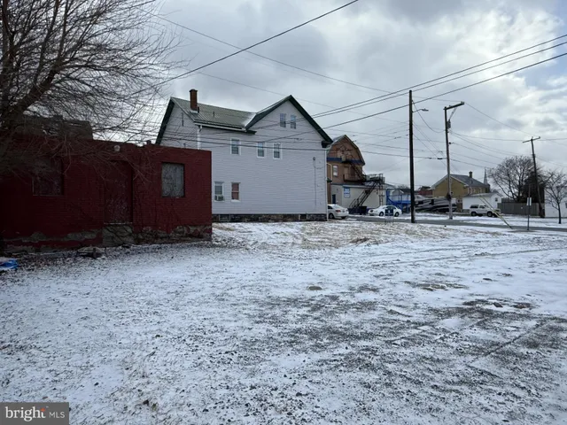 a view of a barn house next to a yard