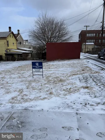 a view of a bench in the backyard