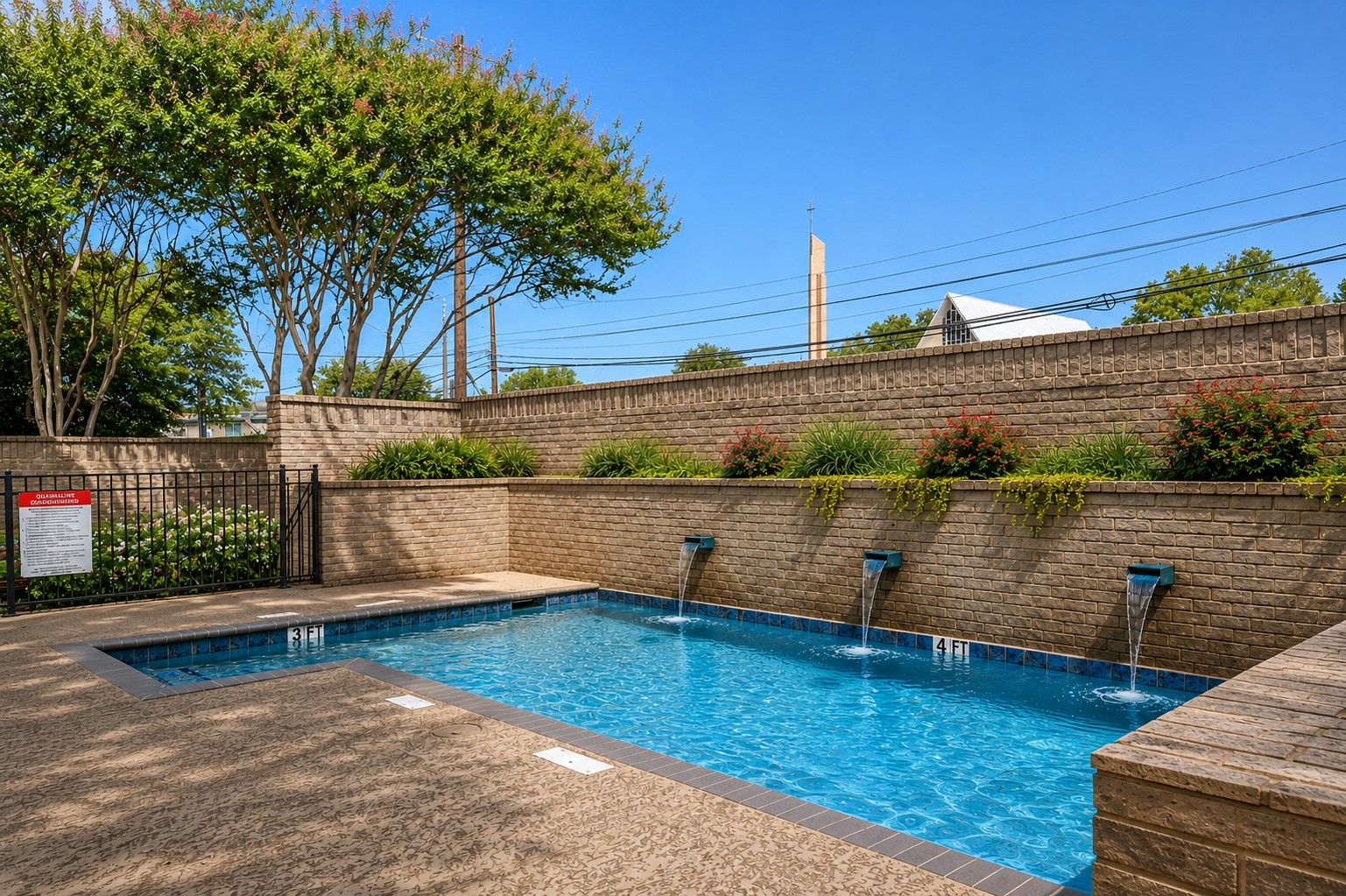 611 East 45th Street, Unit 25 Austin, TX 78751 - Photo 3 of 21 Resort-style pool with integrated water features and a perimeter of mature landscaping
