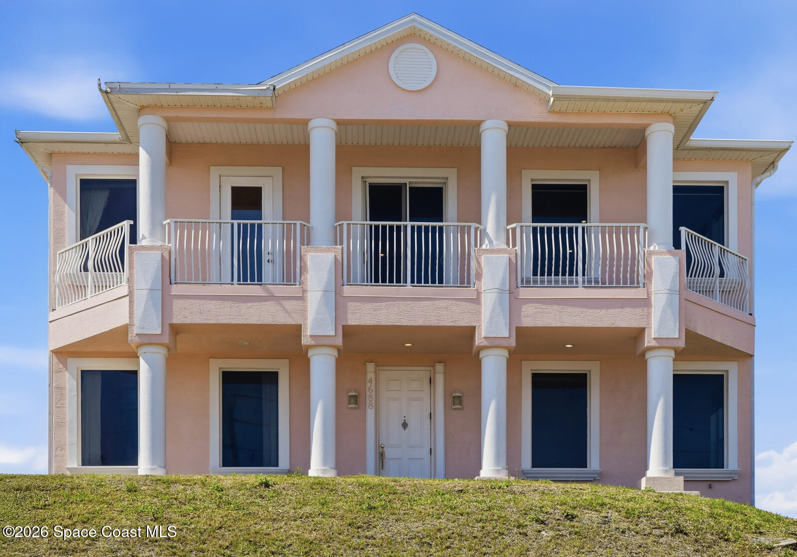 4688 South Atlantic Avenue Ponce Inlet, FL 32127 - Photo 1 of 83 a front view of a house with many windows
