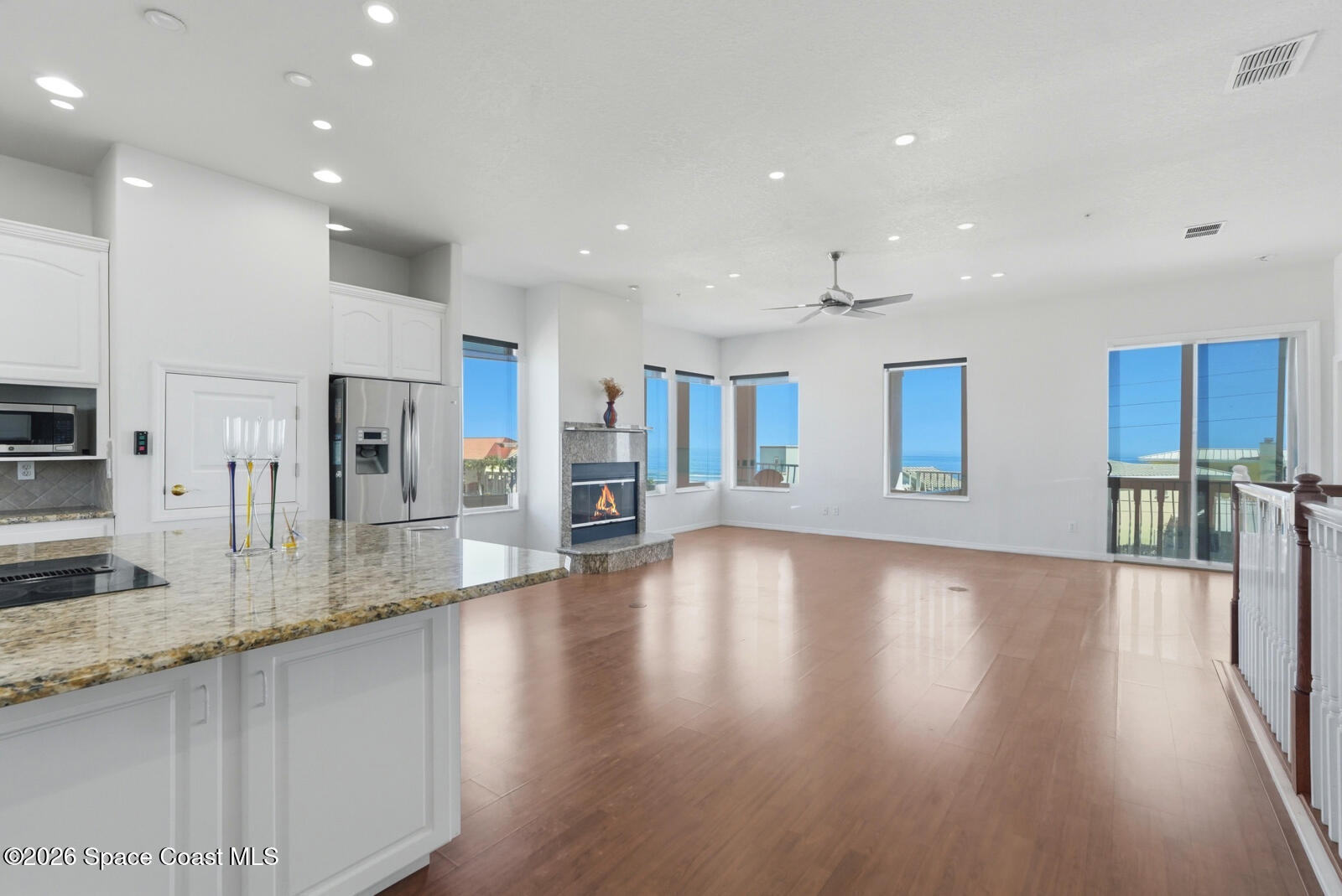 4688 South Atlantic Avenue Ponce Inlet, FL 32127 - Photo 11 of 83 a large kitchen with stainless steel appliances granite countertop a large counter top a sink and a refrigerator