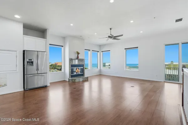 a view of a kitchen with stainless steel appliances granite countertop a stove and a granite counter tops