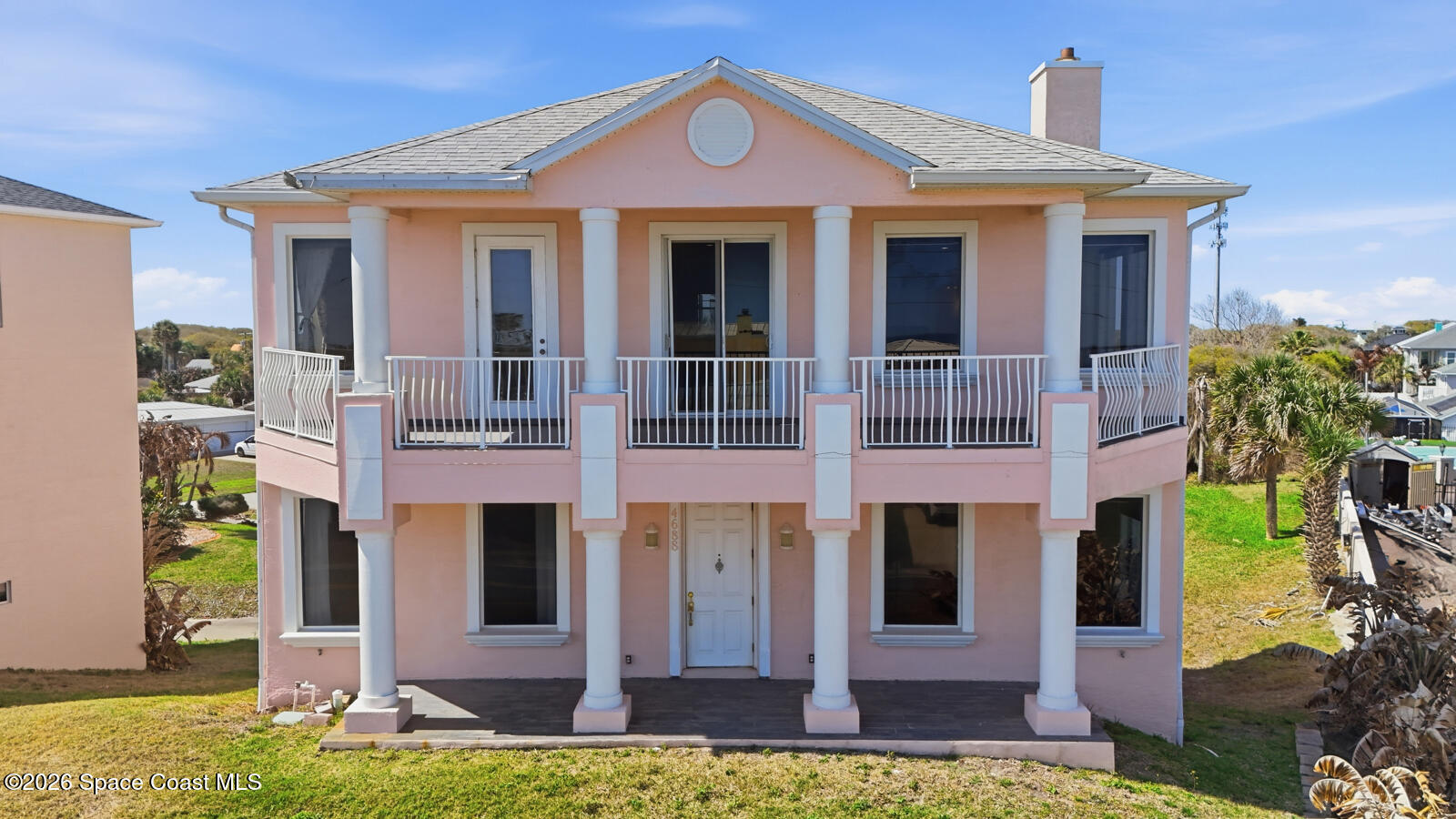 4688 South Atlantic Avenue Ponce Inlet, FL 32127 - Photo 2 of 83 a front view of a house with garden