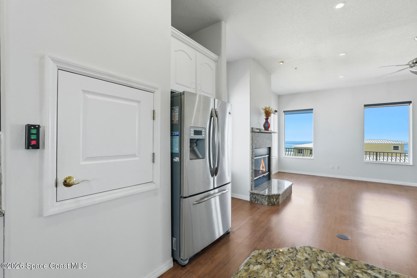 4688 South Atlantic Avenue Ponce Inlet, FL 32127 - Photo 25 of 83 a kitchen with stainless steel appliances granite countertop a refrigerator and a stove top oven