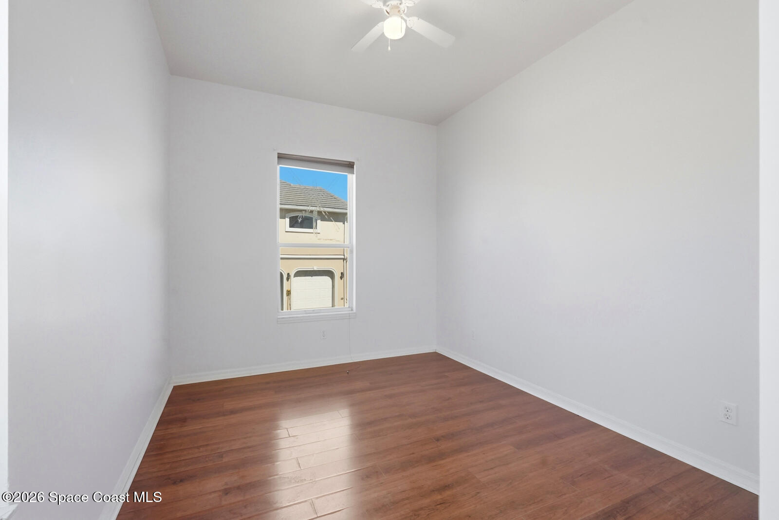 4688 South Atlantic Avenue Ponce Inlet, FL 32127 - Photo 44 of 83 a view of an empty room with wooden floor and a window