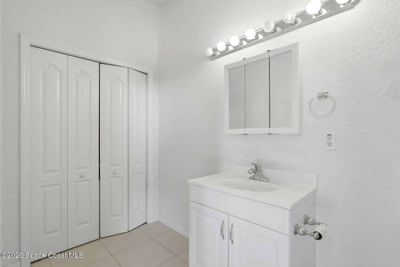 4688 South Atlantic Avenue Ponce Inlet, FL 32127 - Photo 46 of 83 a bathroom with a sink and a mirror