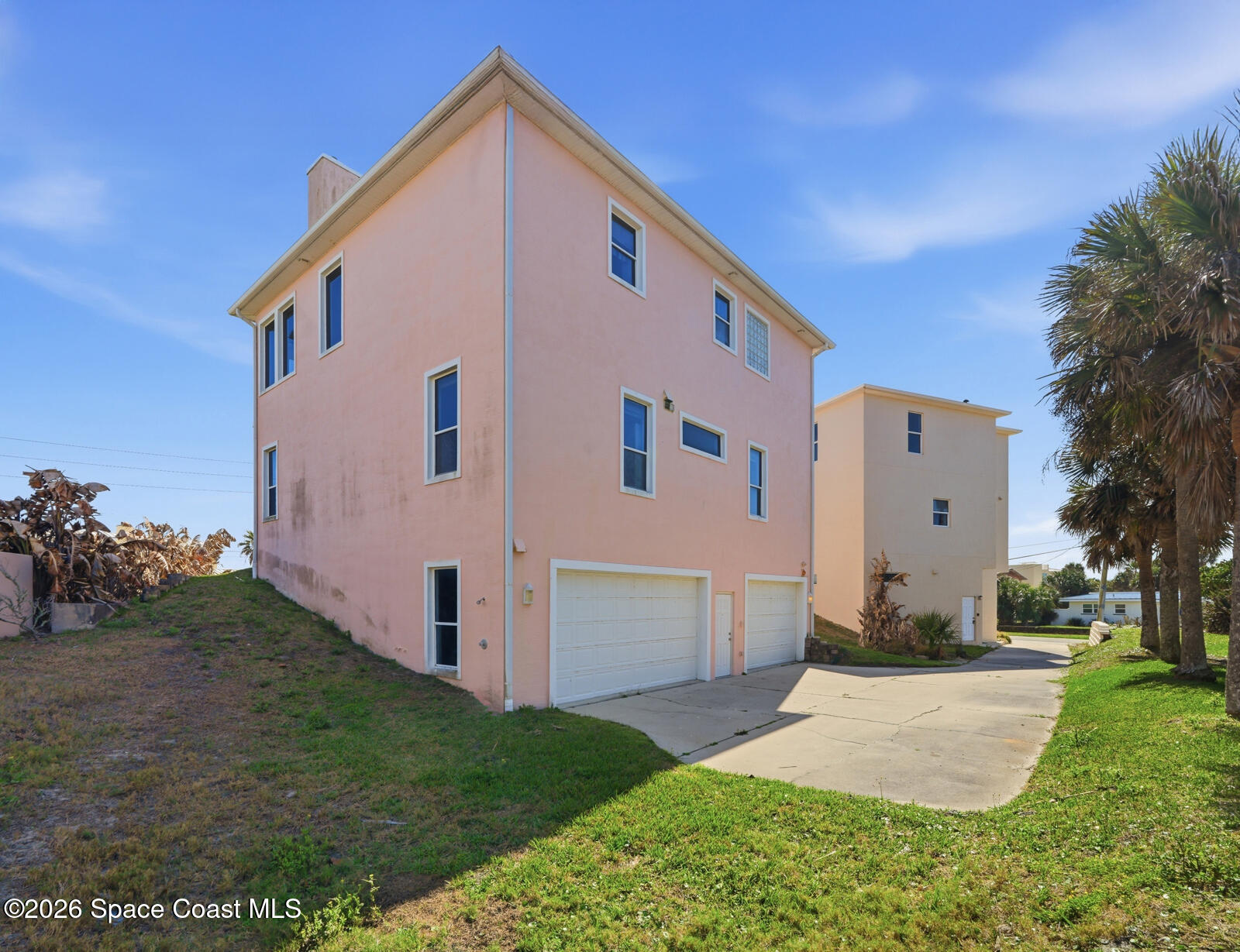 4688 South Atlantic Avenue Ponce Inlet, FL 32127 - Photo 57 of 83 a front view of a house with a yard