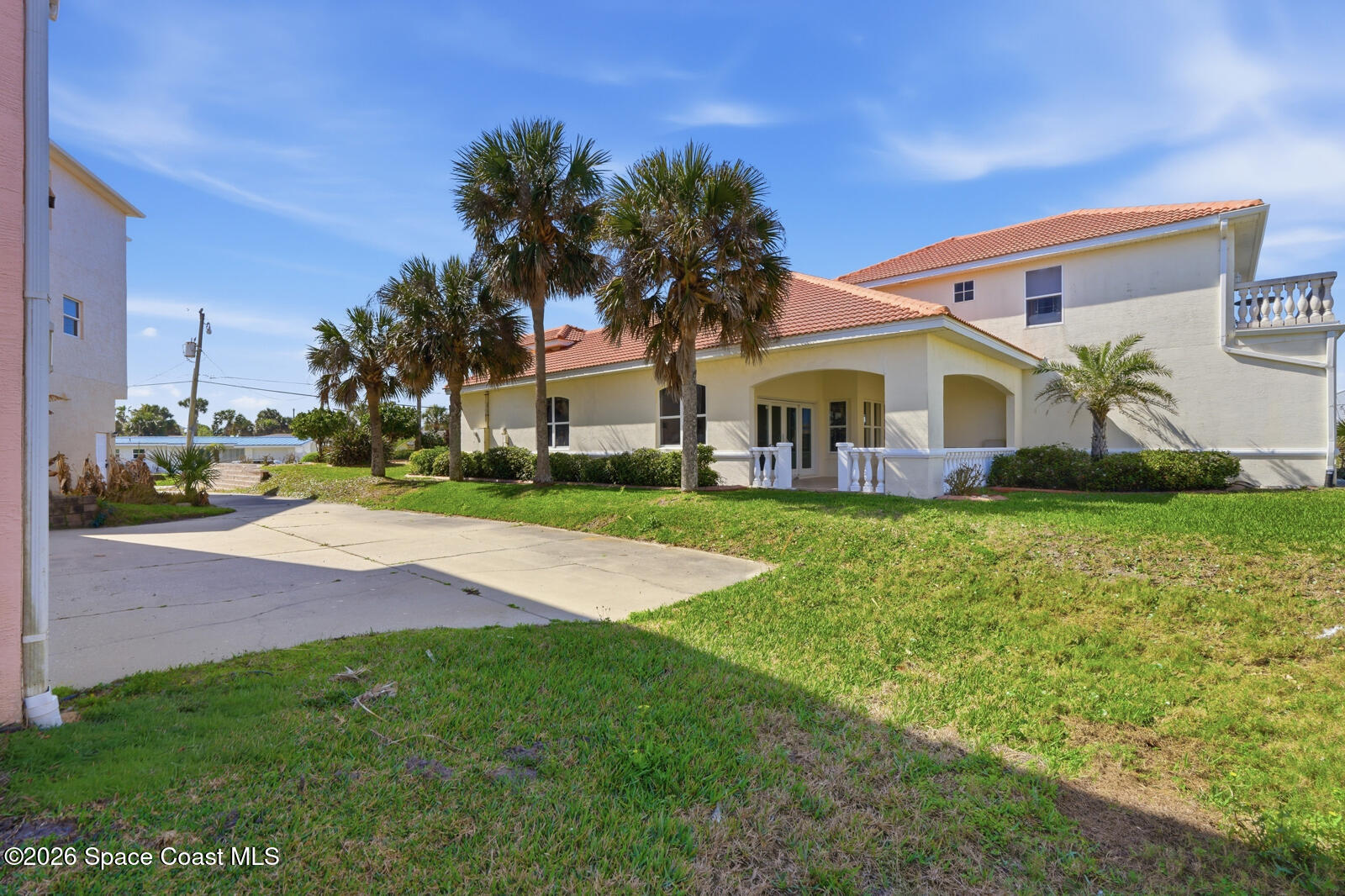 4688 South Atlantic Avenue Ponce Inlet, FL 32127 - Photo 58 of 83 a front view of a house with garden