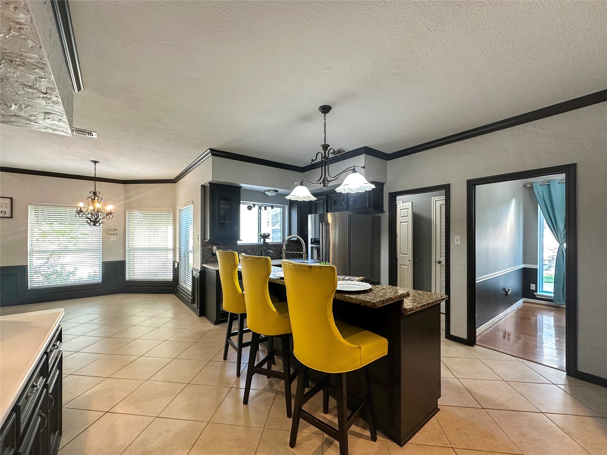 17003 Misty Creek Drive Spring, TX 77379 - Photo 14 of 50 a view of a dining room with furniture and chandelier or bathroom