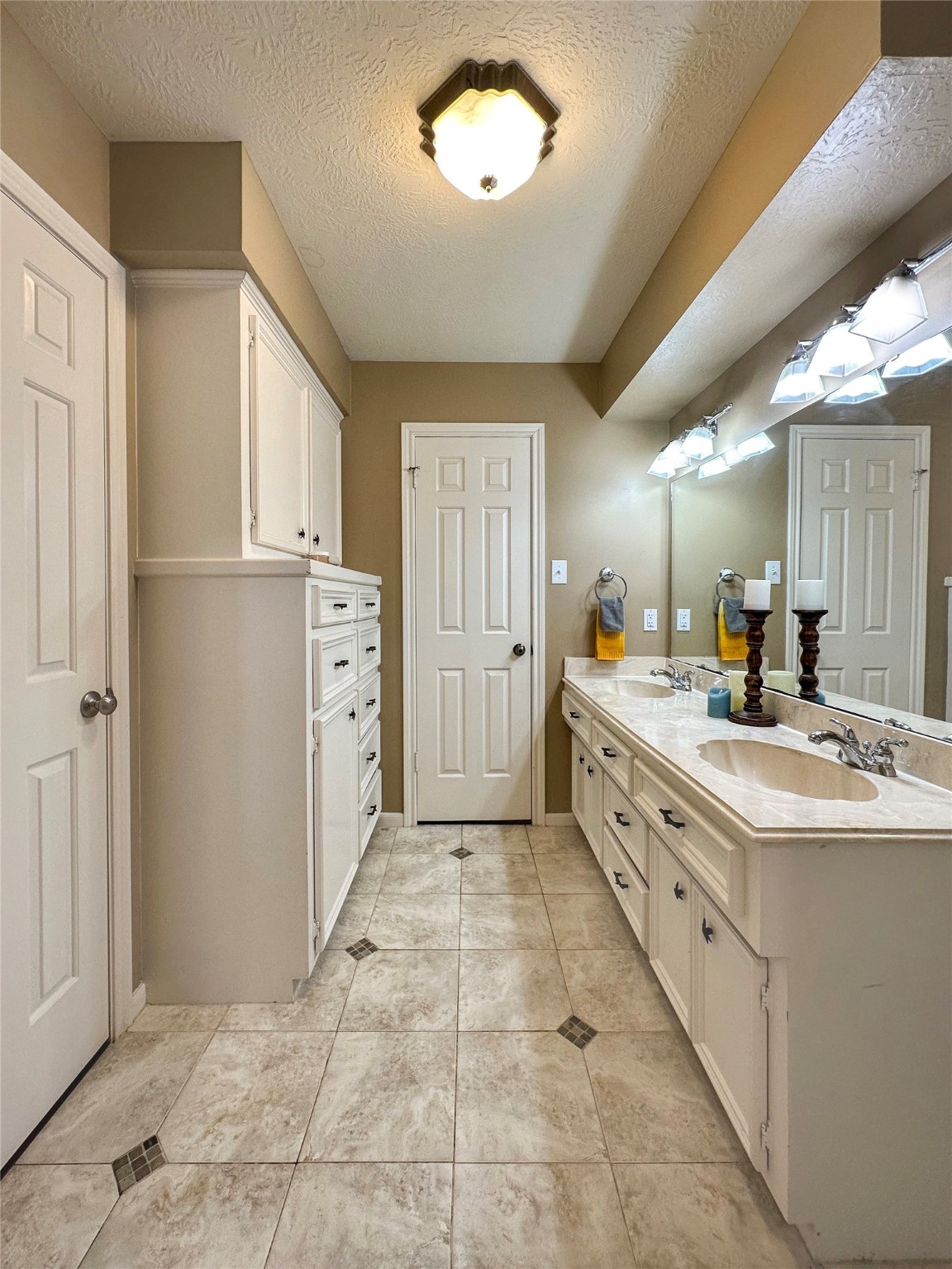 17003 Misty Creek Drive Spring, TX 77379 - Photo 29 of 50 a large white kitchen with a stove a refrigerator a sink dishwasher with a dining table and chairs