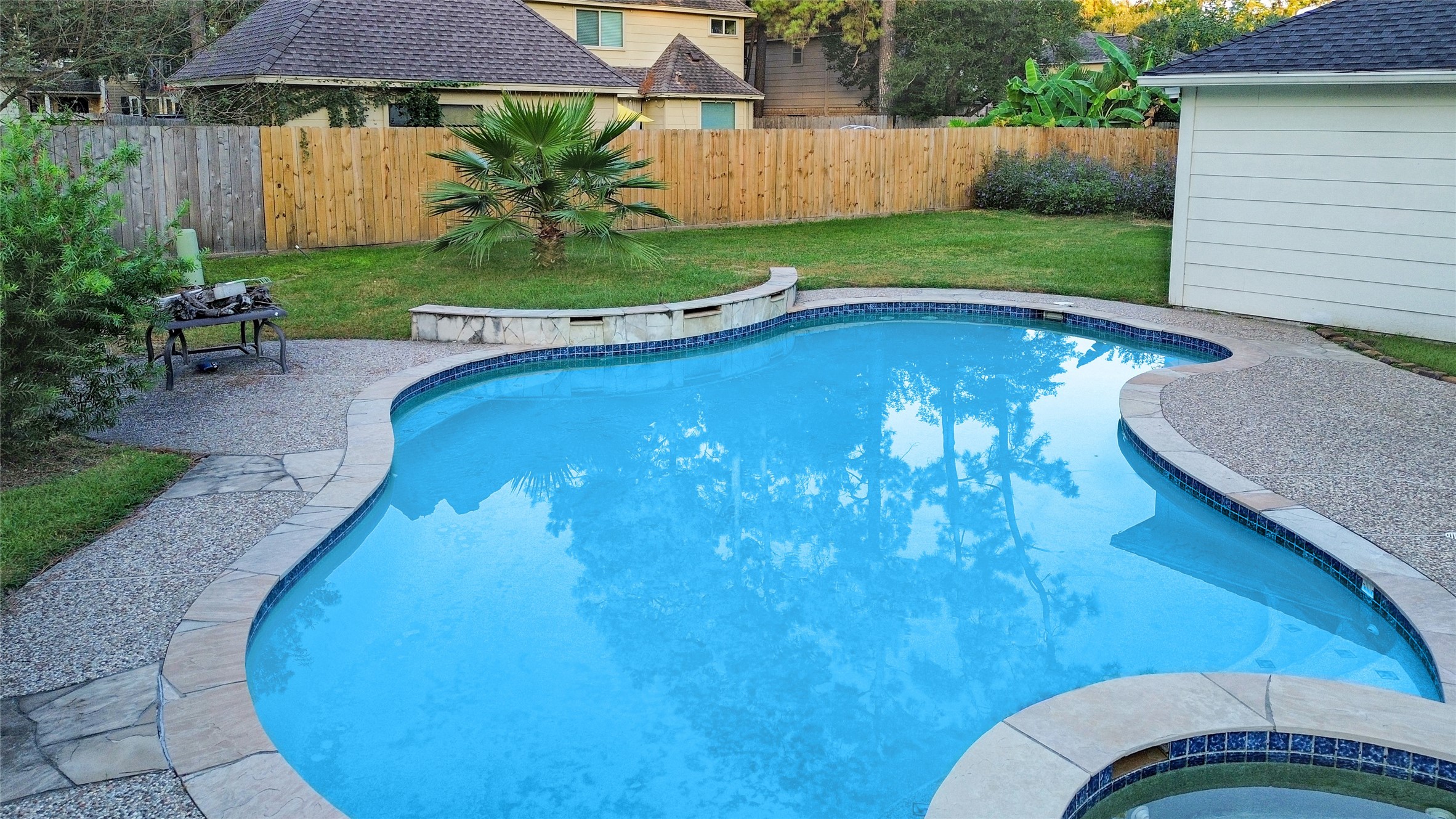 17003 Misty Creek Drive Spring, TX 77379 - Photo 3 of 50 a view of a swimming pool with a patio