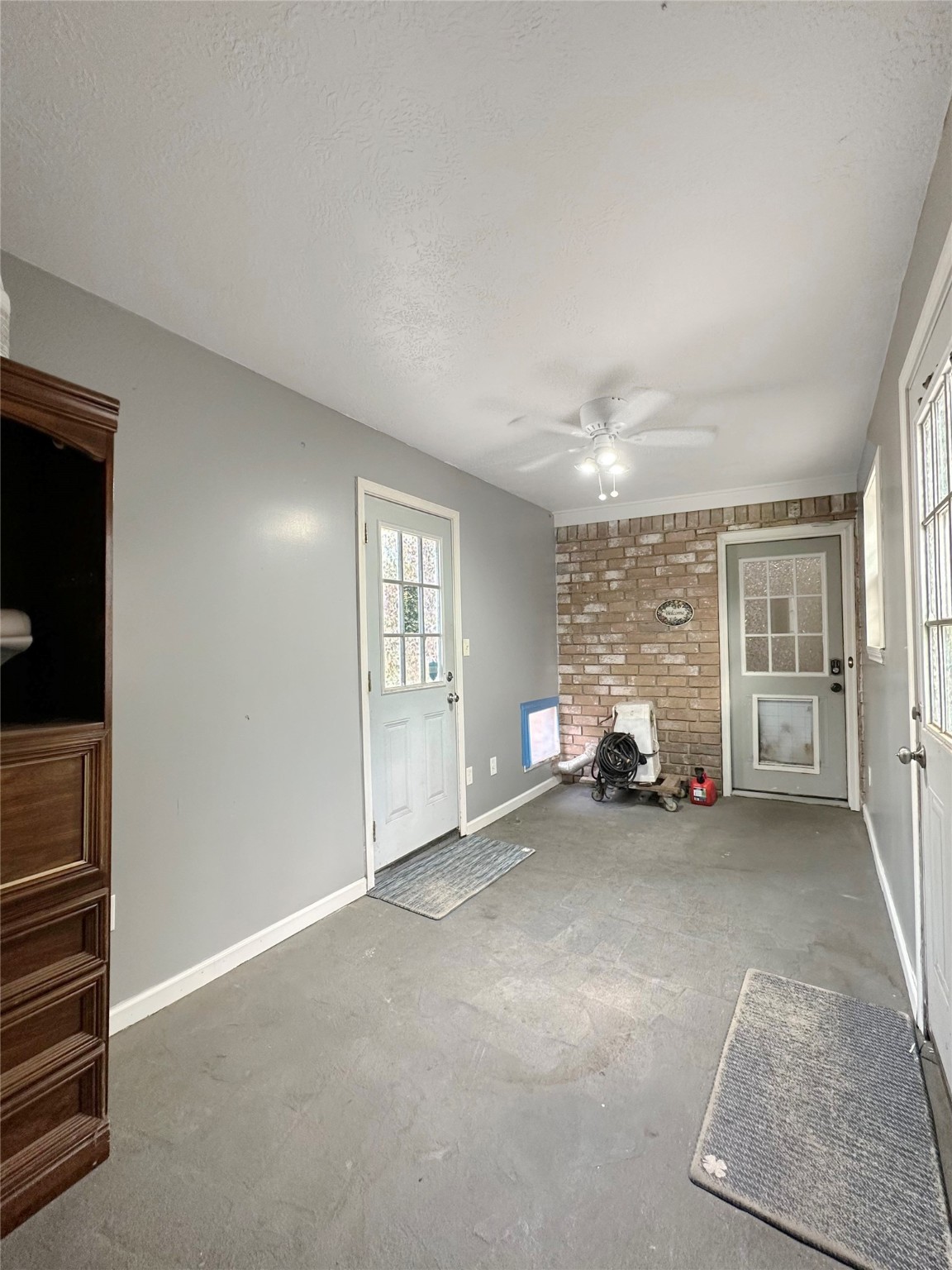17003 Misty Creek Drive Spring, TX 77379 - Photo 34 of 50 Mudroom serves as a practical transition space between the garage and the main home. It connects directly to the utility room and also offers access to the driveway and backyard patio/pool. Perfect for busy households, this setup helps keep the main living spaces clean and organized.