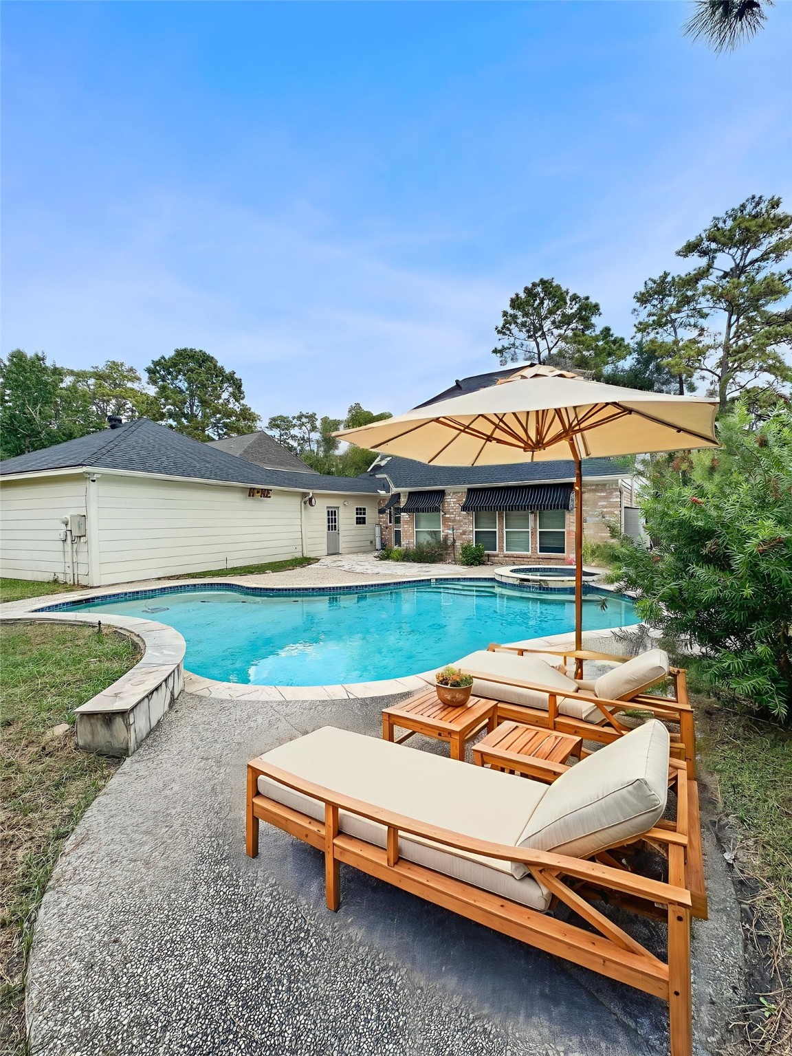 17003 Misty Creek Drive Spring, TX 77379 - Photo 4 of 50 a view of swimming pool with outdoor seating and yard