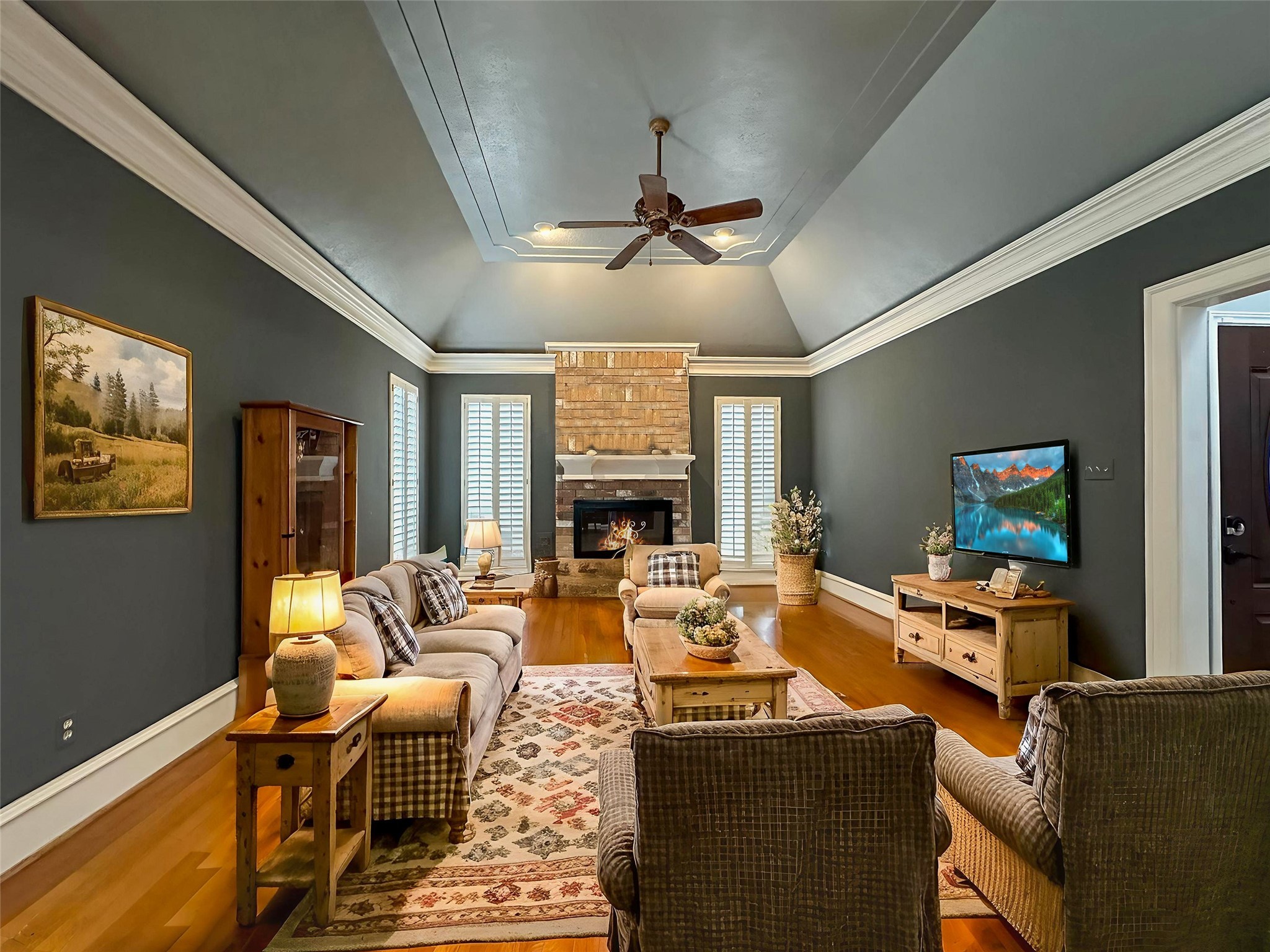 17003 Misty Creek Drive Spring, TX 77379 - Photo 5 of 50 a living room with fireplace furniture and a flat screen tv