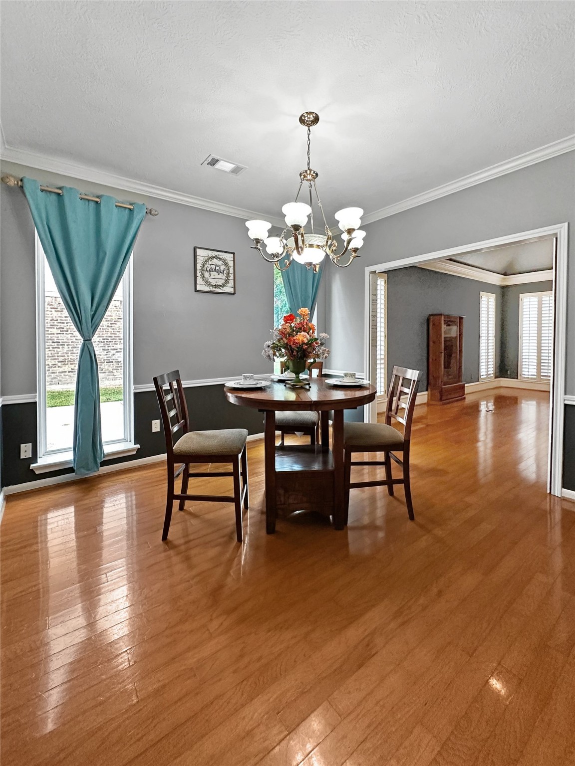 17003 Misty Creek Drive Spring, TX 77379 - Photo 7 of 50 a view of a dining room with furniture and wooden floor