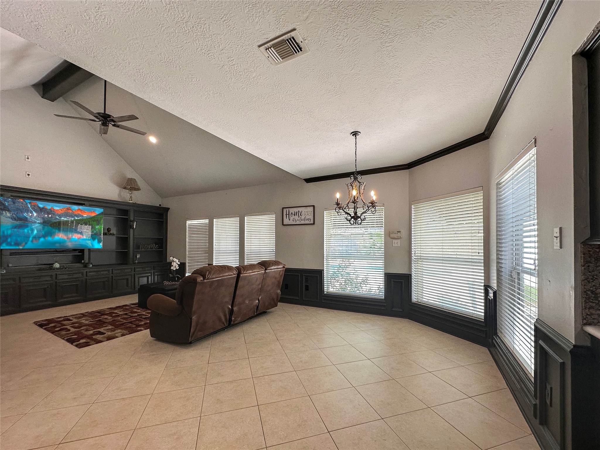 17003 Misty Creek Drive Spring, TX 77379 - Photo 10 of 50 a living room with furniture and a flat screen tv