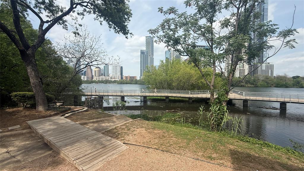 500 East Riverside Drive, Unit 132 Austin, TX 78704 - Photo 25 of 31 a view of a lake with chairs and trees