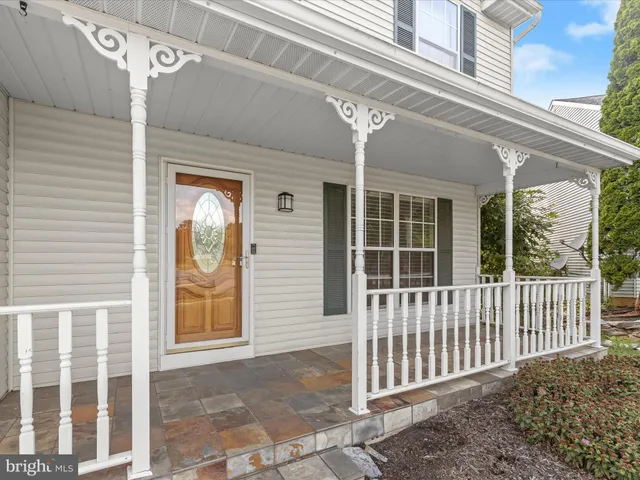 a front view of a house with a porch