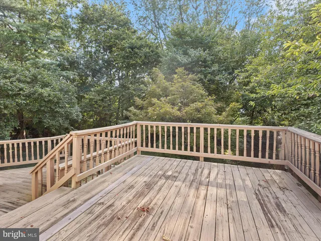 a view of deck with wooden floor and fence