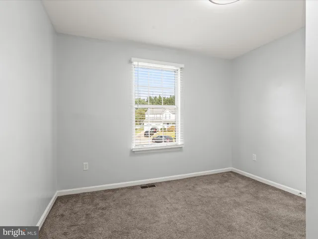 a view of a hallway with closet area