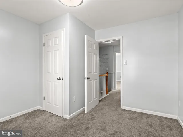 a bathroom with a bath tub sink mirror vanity and toilet
