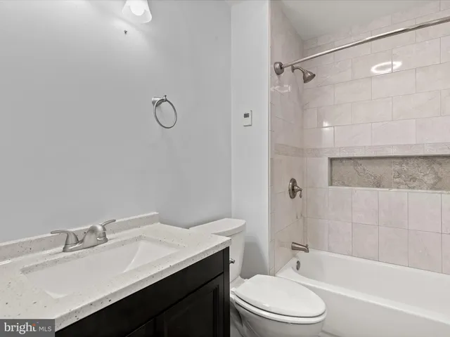 a bathroom with a shower and a bath tub