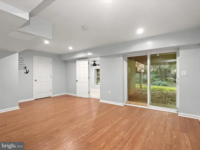 a bathroom with a granite countertop sink toilet a mirror a vanity and shower