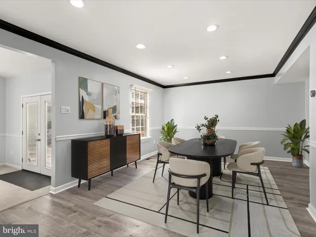 a view of a livingroom with furniture and a potted plant
