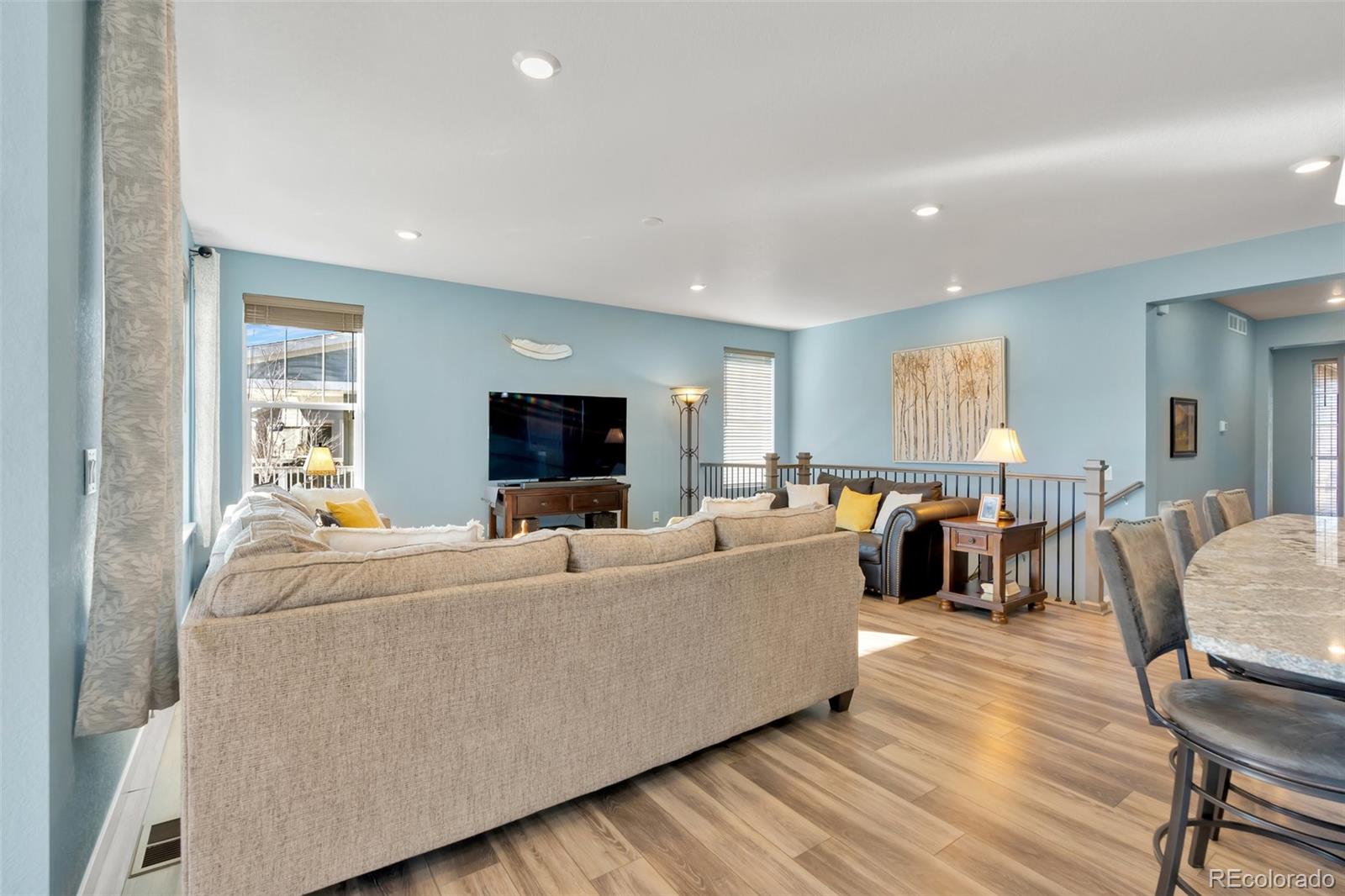 1122 Highpoint Trail Elizabeth, CO 80107 - Photo 11 of 45 a living room with furniture and a flat screen tv